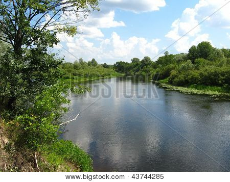 landscape with river and white clouds