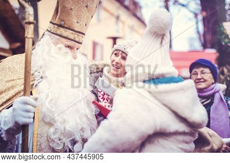 St Nikolaus and an extended family on the Christmas market