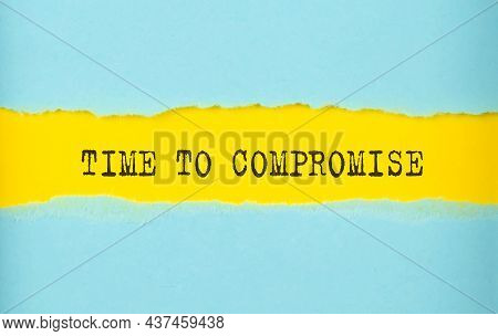 Time To Compromise Text On Torn Paper , Yellow Background