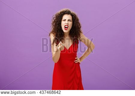 Woman In Fury Fighting With Husband Over Money Making Italian Gesture With Fingers Shouting And Yell