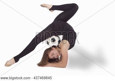 Caucasian Gymnast Sportswoman In Training Outfit During Legs Split Exercises Muscles Stretching With