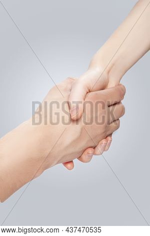Two Hands Of Caucasian Couple Connected Together Demonstrating Support And Encuragement Of Two Lovin