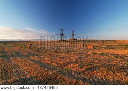 Haystack On Field On Blue Sky Background. Hay Bale From Residues Grass. Hay Stack For Agriculture. H