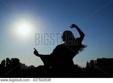Silhouette Dance. Beautiful Caucasian Elegant Girl Dancing During Sunset Or Woman Performing Modern 
