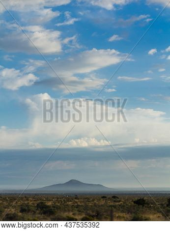 Steppe Mountain, Surrounded By Fog. Specific Steppe Vegetation Can Be Seen.