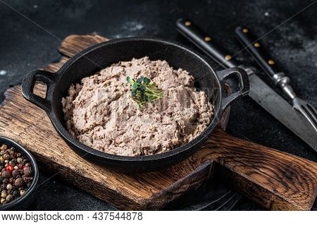 Duck Pate Rillettes De Canard In A Pan With Greens. Black Background. Top View