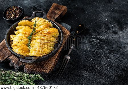 Potato Gratin Dauphinois In A Pan. Black Background. Top View. Copy Space