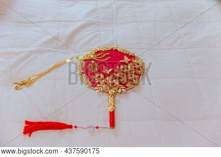 Accessories In A Chinese Wedding. A Fan For The Bride At A Wedding Is Object That Represents Good Me
