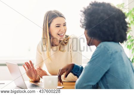 Portrait Of A Young Happy Girl Talking With A Friend