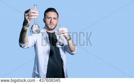 Doctor In A White Coat With A Magnifying Glass. Concept-search For Medicines, Vaccines, And Vaccinat