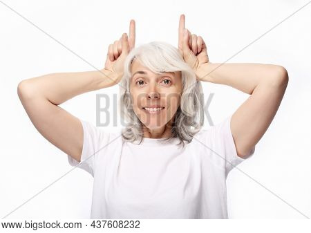 Grandmother with funny expressions isoltaed on white background. Lifestyle and old people concept.