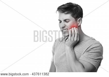 Sad Young European Male Suffering From Toothache, Presses Hand To Cheek With Painful Expression, Mon