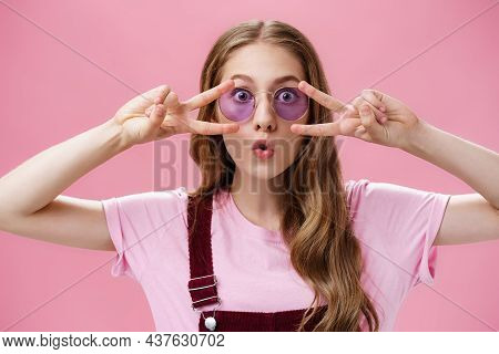 Woman Liking How Sunglasses Finished Outfit. Portrait Of Charming Playful And Charismatic Young Girl
