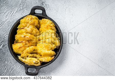 Baked Potato Gratin Dauphinois In A Pan. White Background. Top View. Copy Space