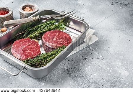 Raw Fillet Mignon Beef Steaks From Tenderloin. Gray Background. Top View. Copy Space