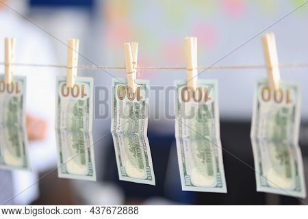 Close-up Of Banknotes Dry On Rope, Money Laundering, Dirty Cash, Washed Paper Bills. Cash Hang Out O