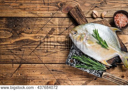 Raw Fish Sunfish Or Pompano On A Wooden Board. Wooden Background. Top View. Copy Space