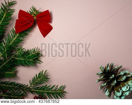 New Year Card. Christmas Card On A Pink Background. Decorations For The Holiday.
Red Bow, Red Beads 