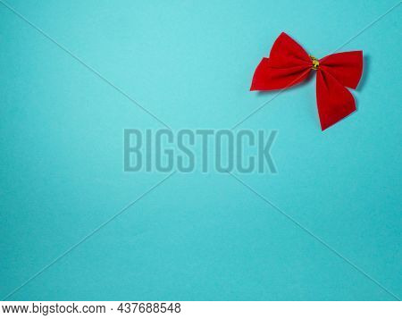 New Year Card. Christmas Card On A Blue Background. Decorations For The Holiday.
Red Bow