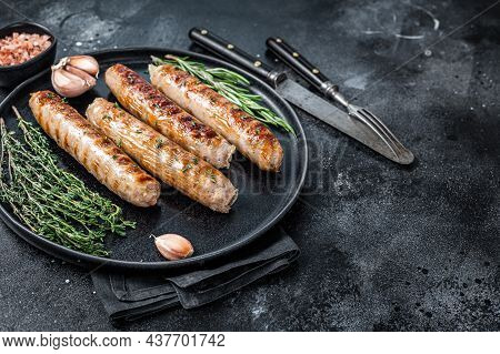 Roasted Bockwurst Pork Meat Sausages In A Plate. Black Background. Top View. Copy Space