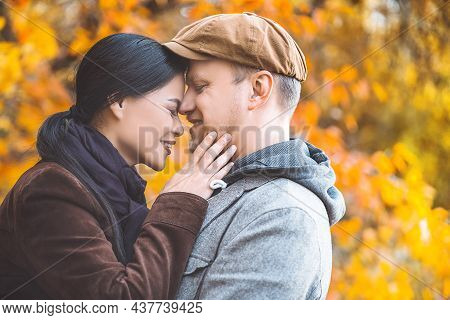 Caucasian Autumn Pair Face-to-face Enjoying One Another. Calm Breath Of Autumn Nature. Close-up. Aut