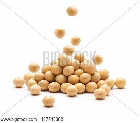Soybean Falling On Heap Of Soybeans Isolated On White Background