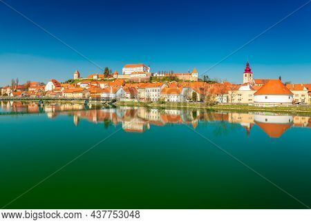 Ptuj - March 2021, Slovenia: Panoramic View Of The Ancient Slovenian Town Of Ptuj Reflected In The W