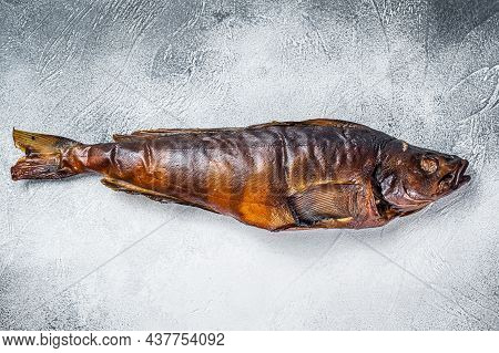 Hot Smoked Whole Fish On Kitchen Table. White Background. Top View