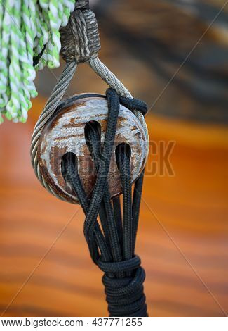 A Detail Of A Sailboat. Here A So-called Three-holed Maiden, Rope Pulley.