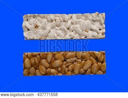 Top View Of 2 Different Types Of Spanish Turrons On Blue Background