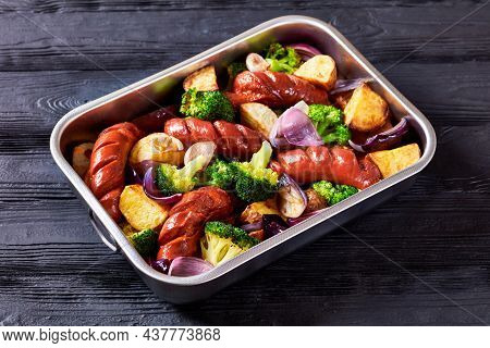 Sausage And Vegetable Traybake With Smoked Pork Sausage, Broccoli, Potato, Red Onion, Garlic On A Ba