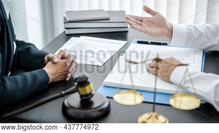 Businessman Is Bringing The Legal Document For Consultation With Female Lawyer And She Is Explaining