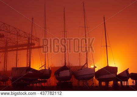 Klaipeda, Lithuania - 01 01 2021: Foggy New Year Night In The City. Ships And Yachts Silhouettes In 