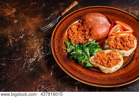 Toasts With Sobrassada Cured Pork Meat Sausage And Tomato. Dark Background. Top View. Copy Space