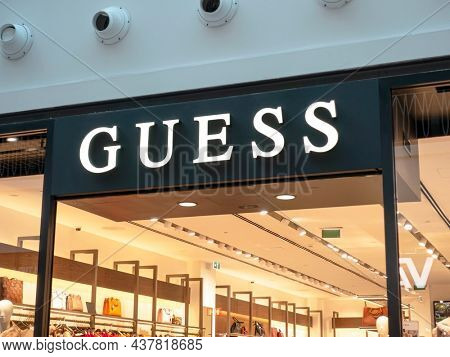 Funchal, Portugal - Oct 23, 2021: Guess store sign. Guess is an American clothing brand and retailer