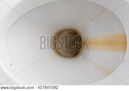 Close-up Dirty Toilet Bowl, Traces Of Limescale And Rust