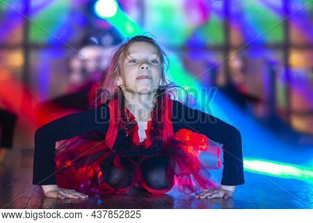 A Little Girl Performs A Dance Number. The Child Is Dancing Emotionally.