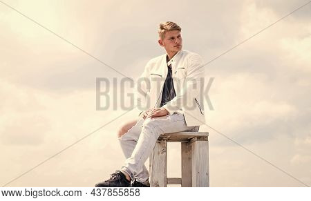 Be Your Own Compass. Single Guy Sit On Chair Cloudy Sky. Enjoying Rest. Summer Vacation. Travel And 