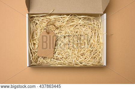 Empty Rectangular Open Corrugated Paper Box With Sawdust Inside. Packaging, Containers For Transport
