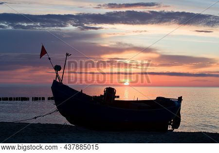 Fishing Boats On The Beach Of The Polish Baltic Coast Near Rewal. Sunset