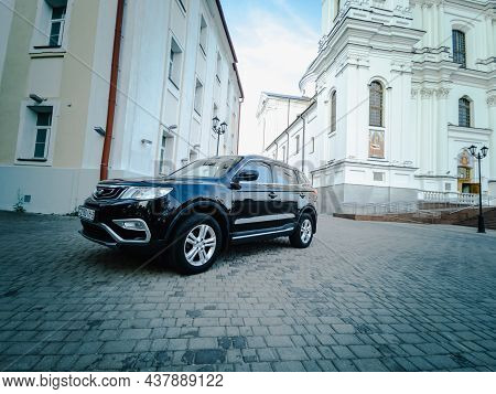 Vitebsk, Belarus - August 2021: Geely Atlas In Black On The Square In Front Of The Holy Dormition Ca