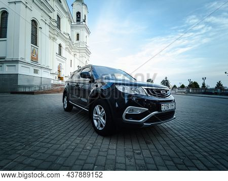 Vitebsk, Belarus - August 2021: Geely Atlas In Black On The Square In Front Of The Holy Dormition Ca