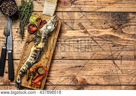 Grilled Whole Icefish With Vegetables. Wooden Background. Top View. Copy Space