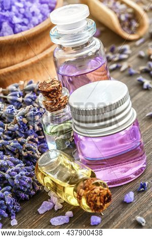 Lavender's Spa Products With Dried Lavender Flowers On A Wooden Table. Flat Lay Bath Salt And Massag