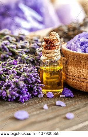 Lavender's Spa Products With Dried Lavender Flowers On A Wooden Table. Flat Lay Bath Salt And Massag