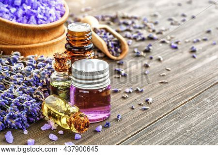 Lavender's Spa Products With Dried Lavender Flowers On A Wooden Table. Flat Lay Bath Salt And Massag