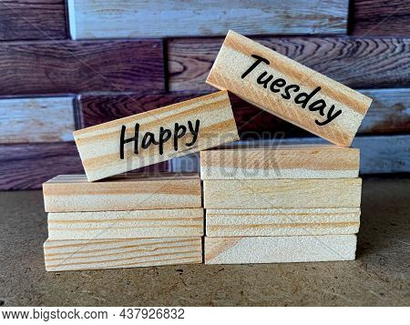 Happy Tuesday Text On Wooden Bricks With Nice Writing
