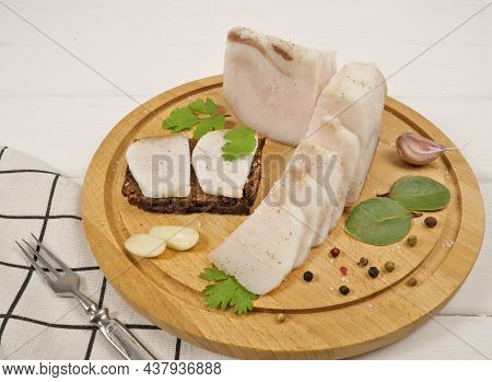 Bacon, Garlic, Cilantro, Bay Leaf, Pepper On A Wooden White Background. Napkin, Fork. Delicious And 