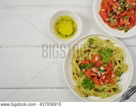 Pasta With Tomatoes And Spices. Salad Of Fresh Tomatoes And Cilantro With Garlic. Olive Oil. Delicio