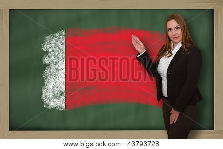 Teacher Showing Flag Ofbahrain On Blackboard For Presentation Marketing And Tourist Advertising